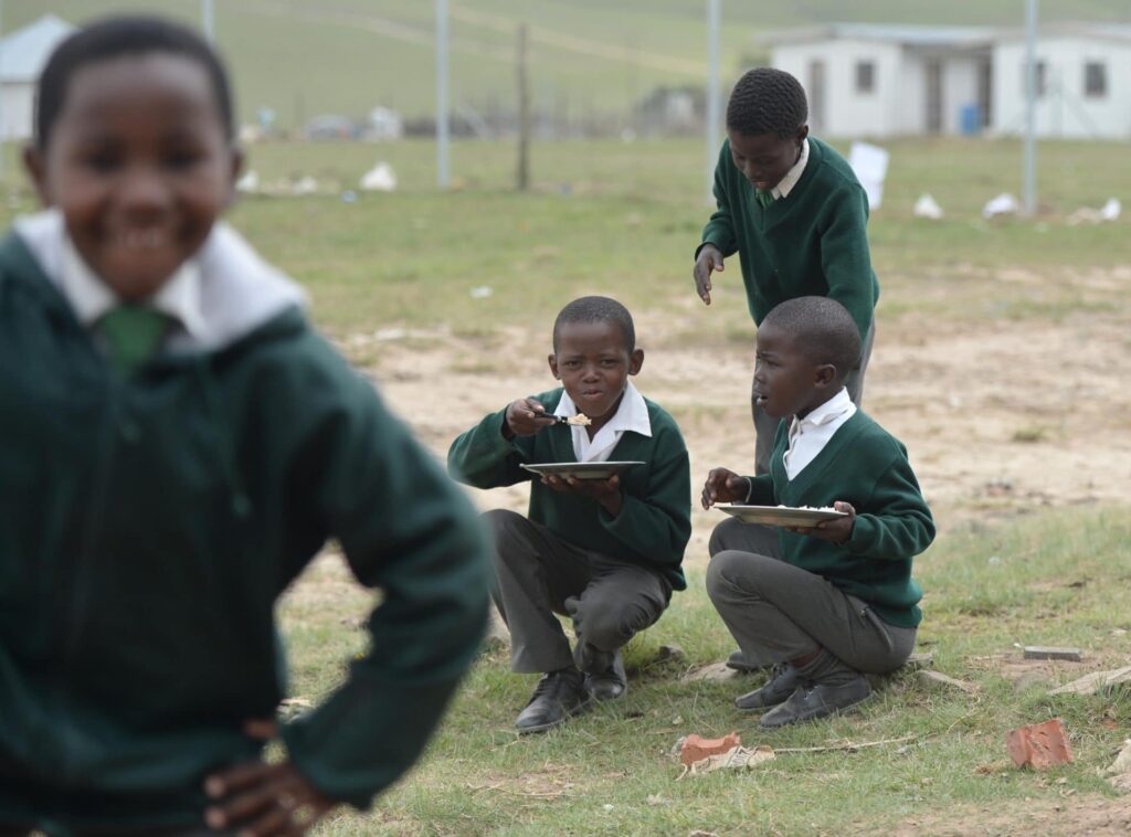 School Boys share lunch