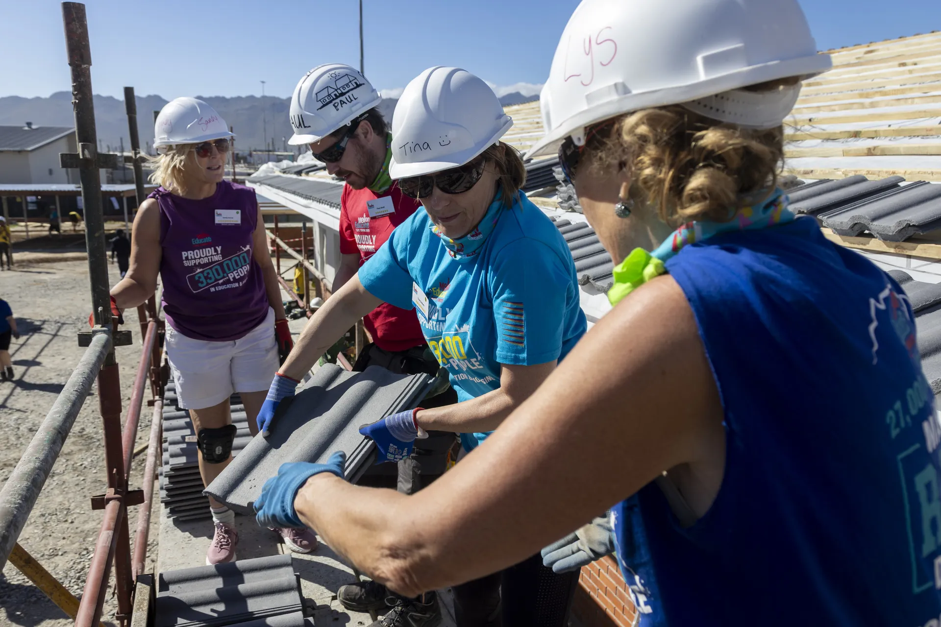 Mellon Educate volunteers on a Building Blitz site in South Africa